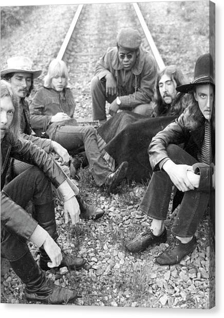 Group Sitting on Railroad Tracks Canvas Print